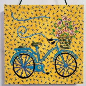 Teal Bike on Yellow Box